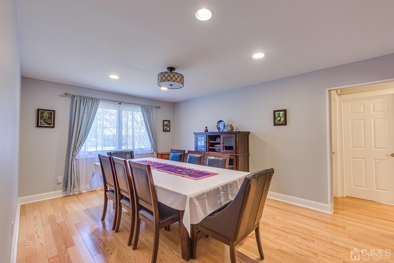 13 Whitewood Road Edison, NJ 08820 - Photo 22 of 50 a view of a dining room with furniture and wooden floor