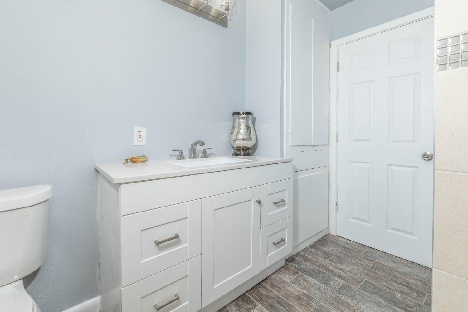 5116 47th Street Lubbock, TX 79414 - Photo 14 of 20 a utility room with sink dryer and washer