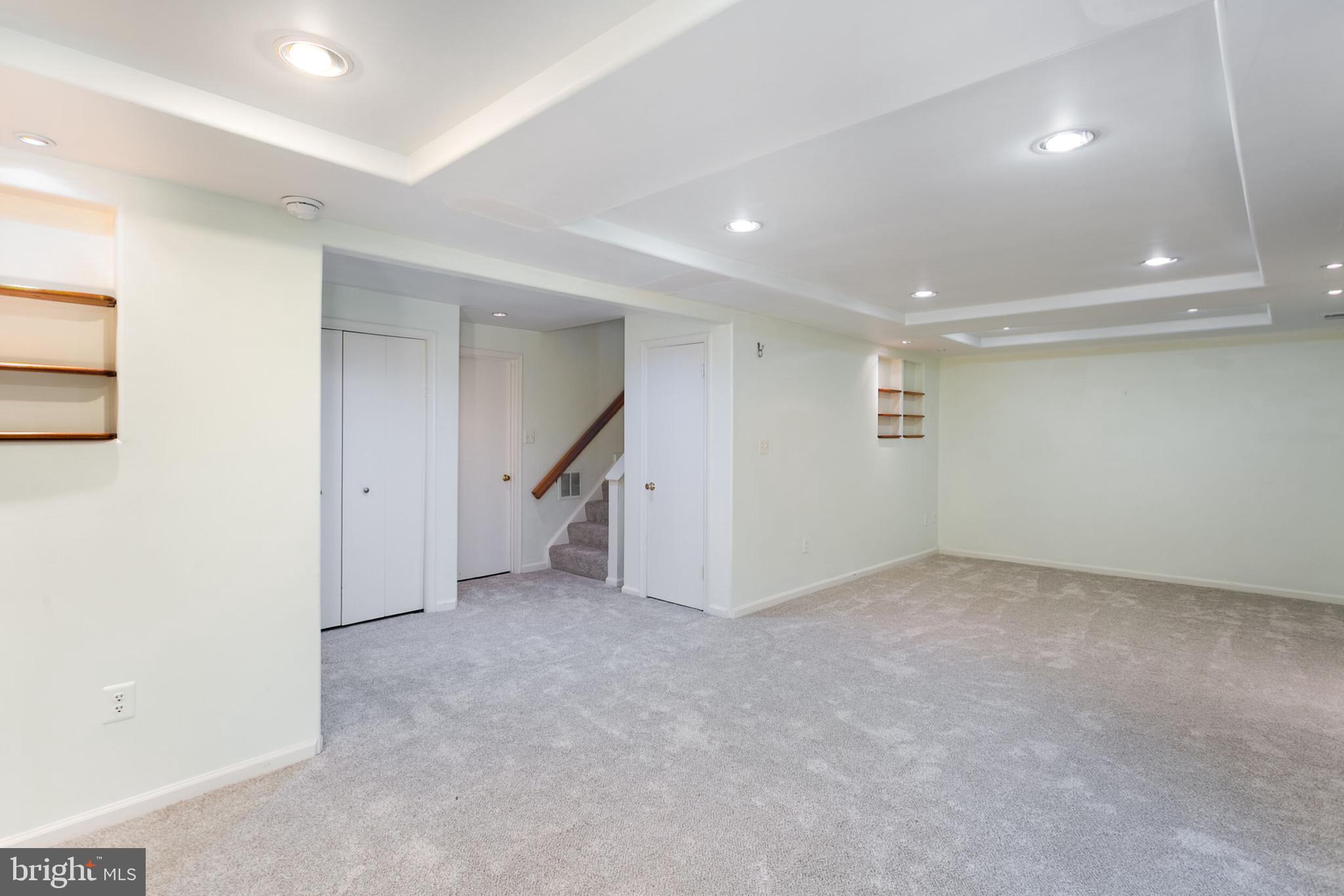 14 Tivoli Lake Court Silver Spring, MD 20906 - Photo 15 of 20 an empty room with a ceiling fan & entryway
