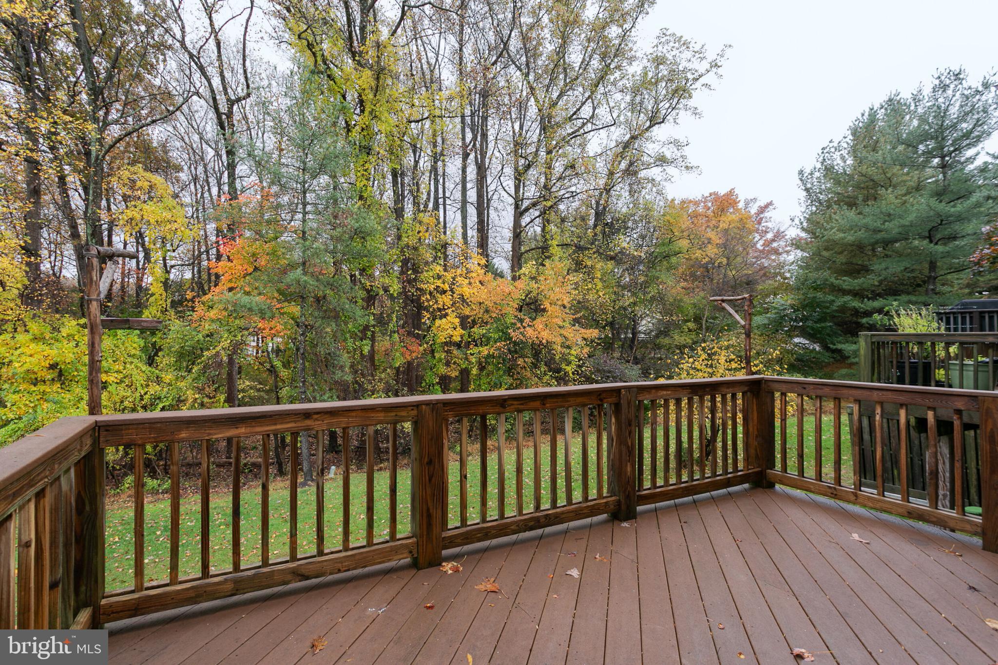 14 Tivoli Lake Court Silver Spring, MD 20906 - Photo 17 of 20 a view of balcony with wooden floor and fence
