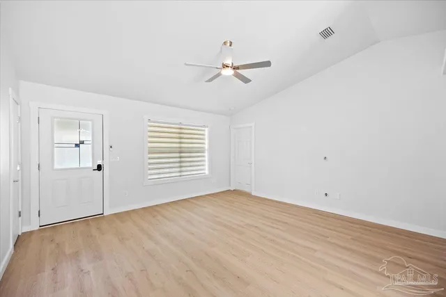 a view of an empty room with a window