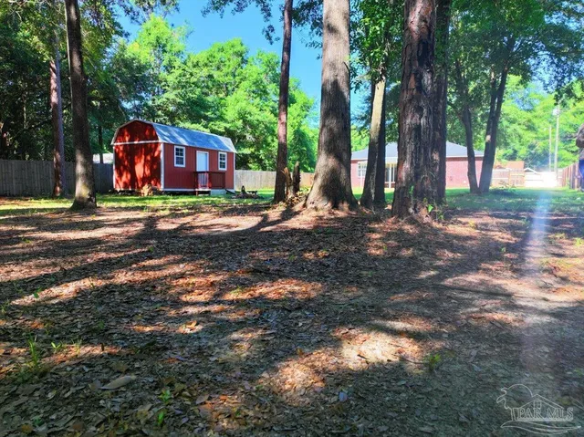 a front view of a house with yard