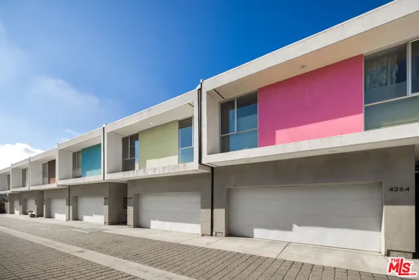 a front view of residential houses with street
