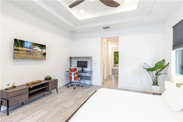 a bedroom with furniture and a piano
