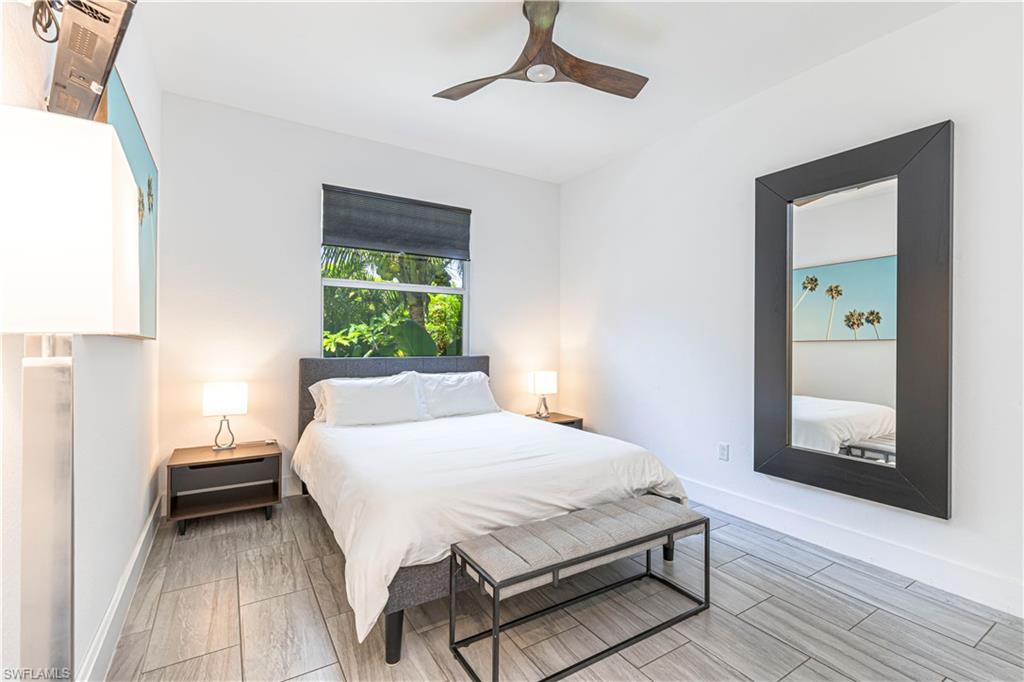 27180 Williams Road Bonita Springs, FL 34135 - Photo 22 of 42 a bedroom with a bed table and a window