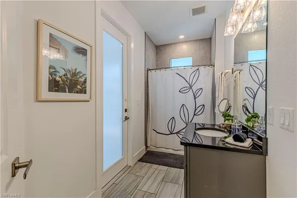 a view of a entryway with furniture and wooden floor