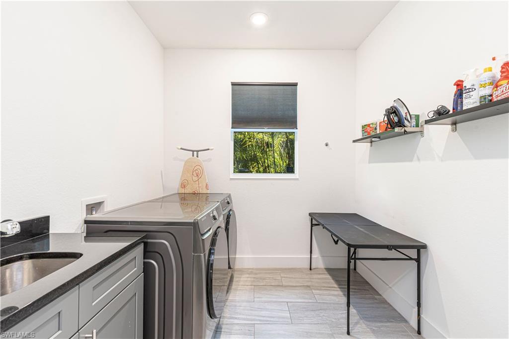 27180 Williams Road Bonita Springs, FL 34135 - Photo 27 of 42 a utility room with sink dryer and washer