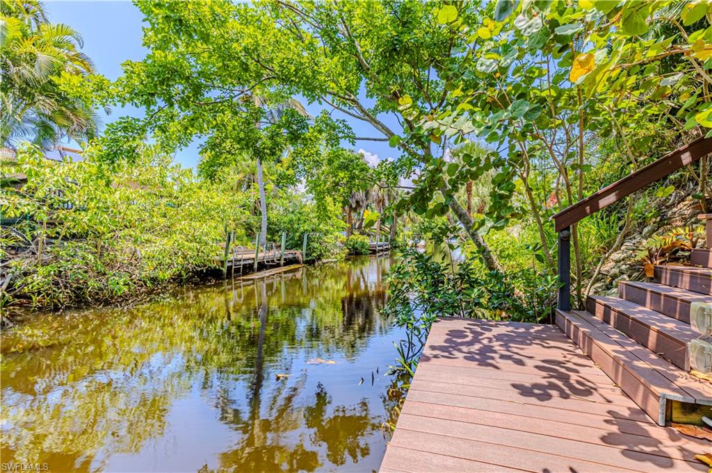 27180 Williams Road Bonita Springs, FL 34135 - Photo 3 of 42 a view of a lake with houses
