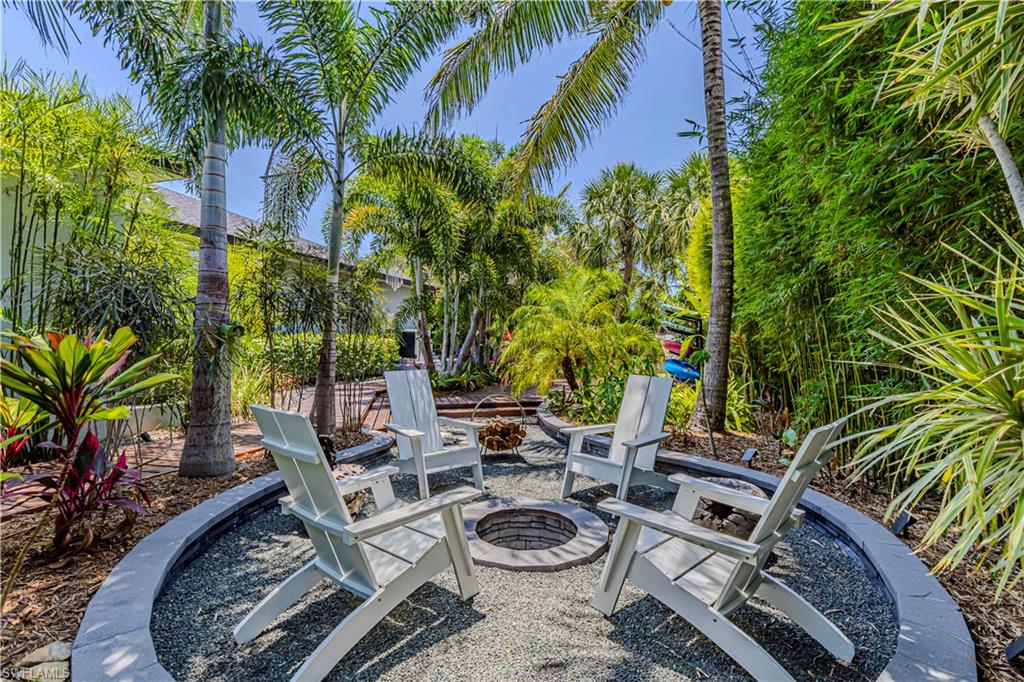 27180 Williams Road Bonita Springs, FL 34135 - Photo 36 of 42 a view of a backyard with plants and a patio