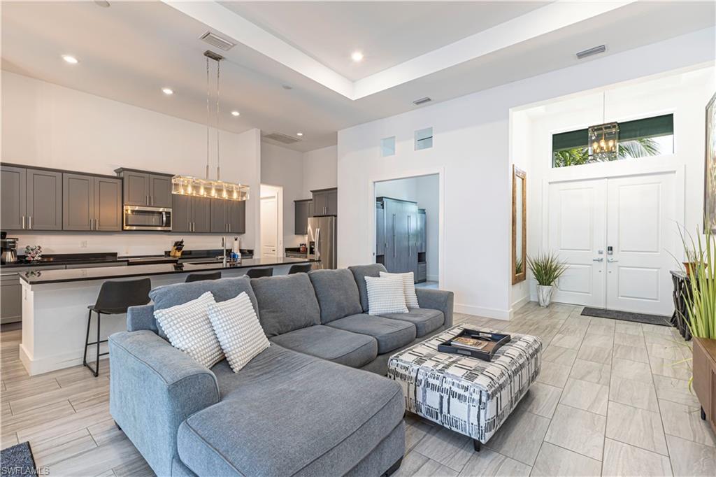 27180 Williams Road Bonita Springs, FL 34135 - Photo 9 of 42 a living room with furniture and a view of kitchen