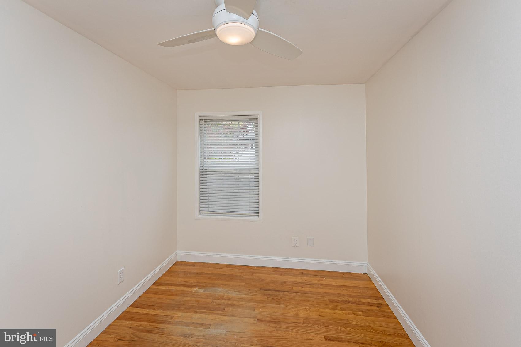 2011 Hanson Road Edgewood, MD 21040 - Photo 23 of 37 an empty room with wooden floor and windows