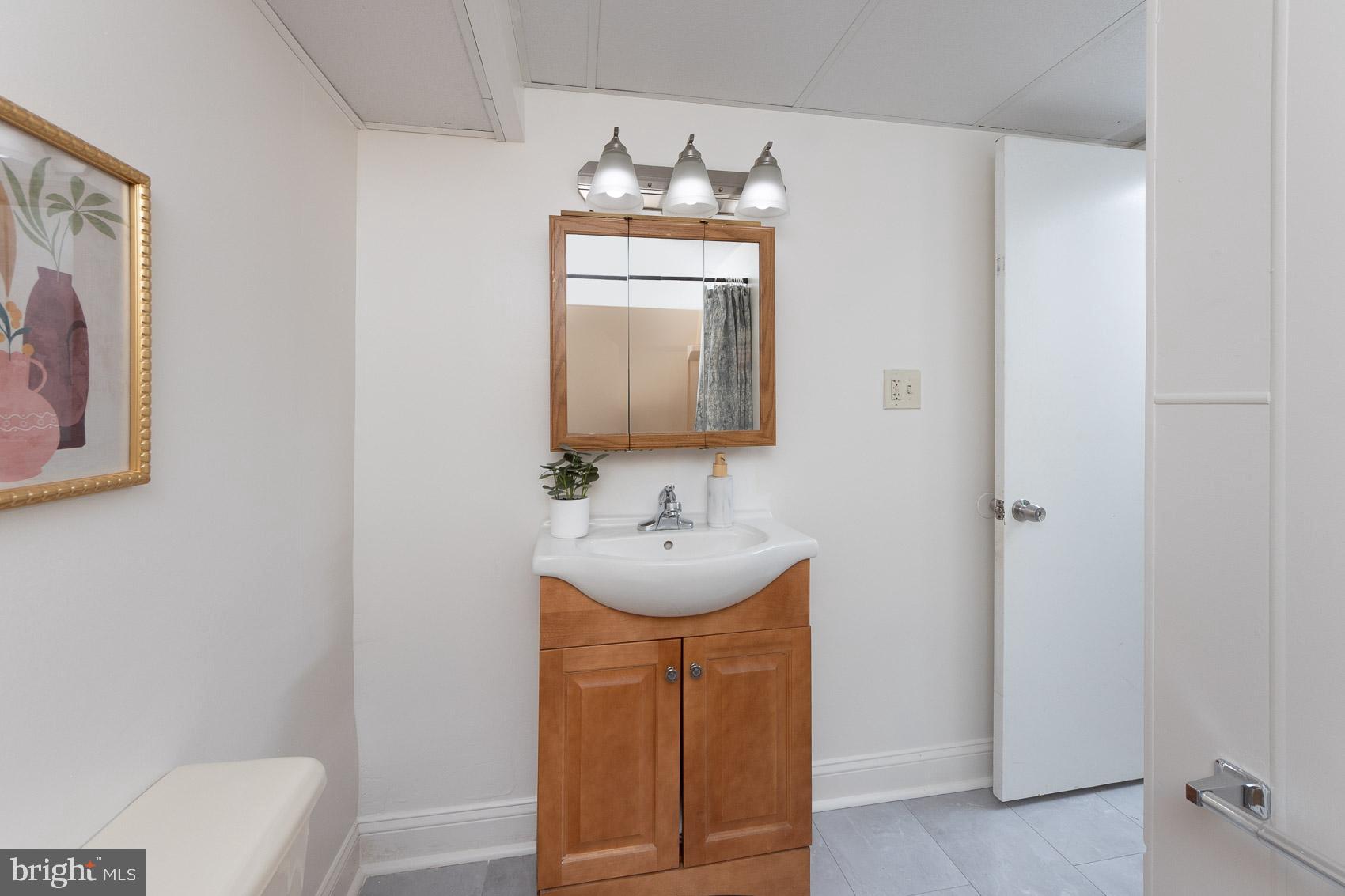 2011 Hanson Road Edgewood, MD 21040 - Photo 28 of 37 a bathroom with a sink and a mirror