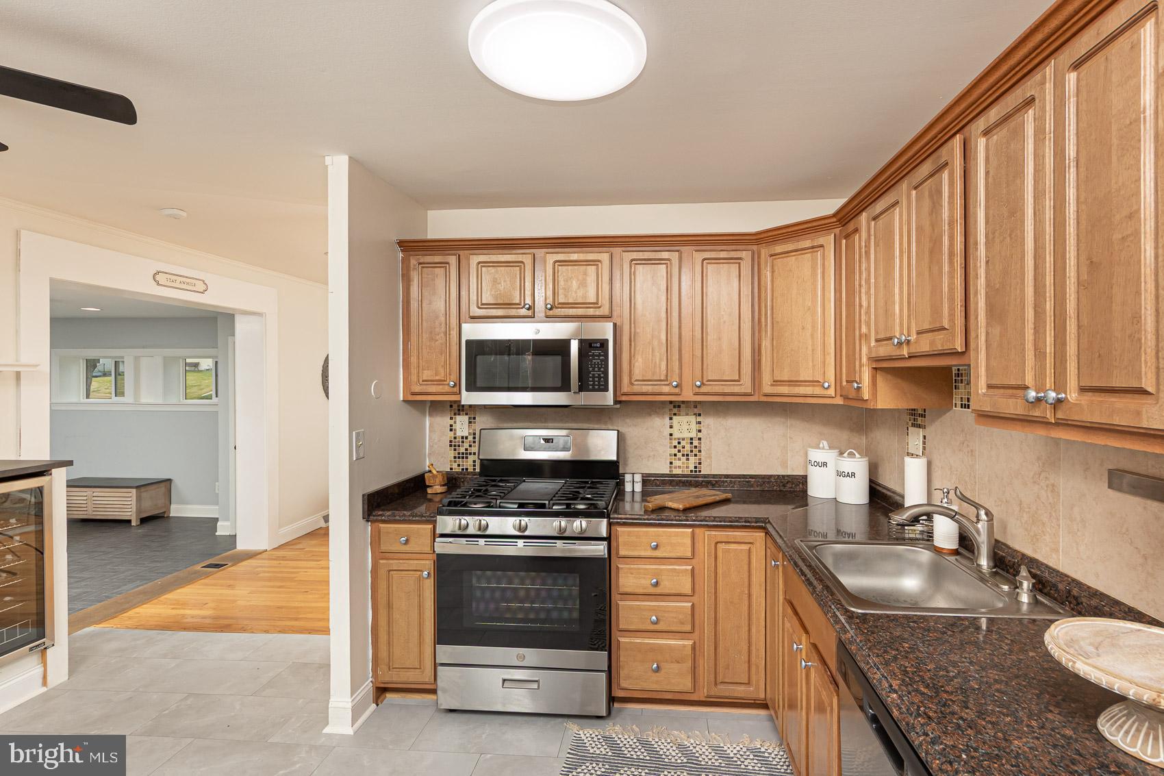 2011 Hanson Road Edgewood, MD 21040 - Photo 5 of 37 a kitchen with stainless steel appliances granite countertop a stove a sink and a microwave