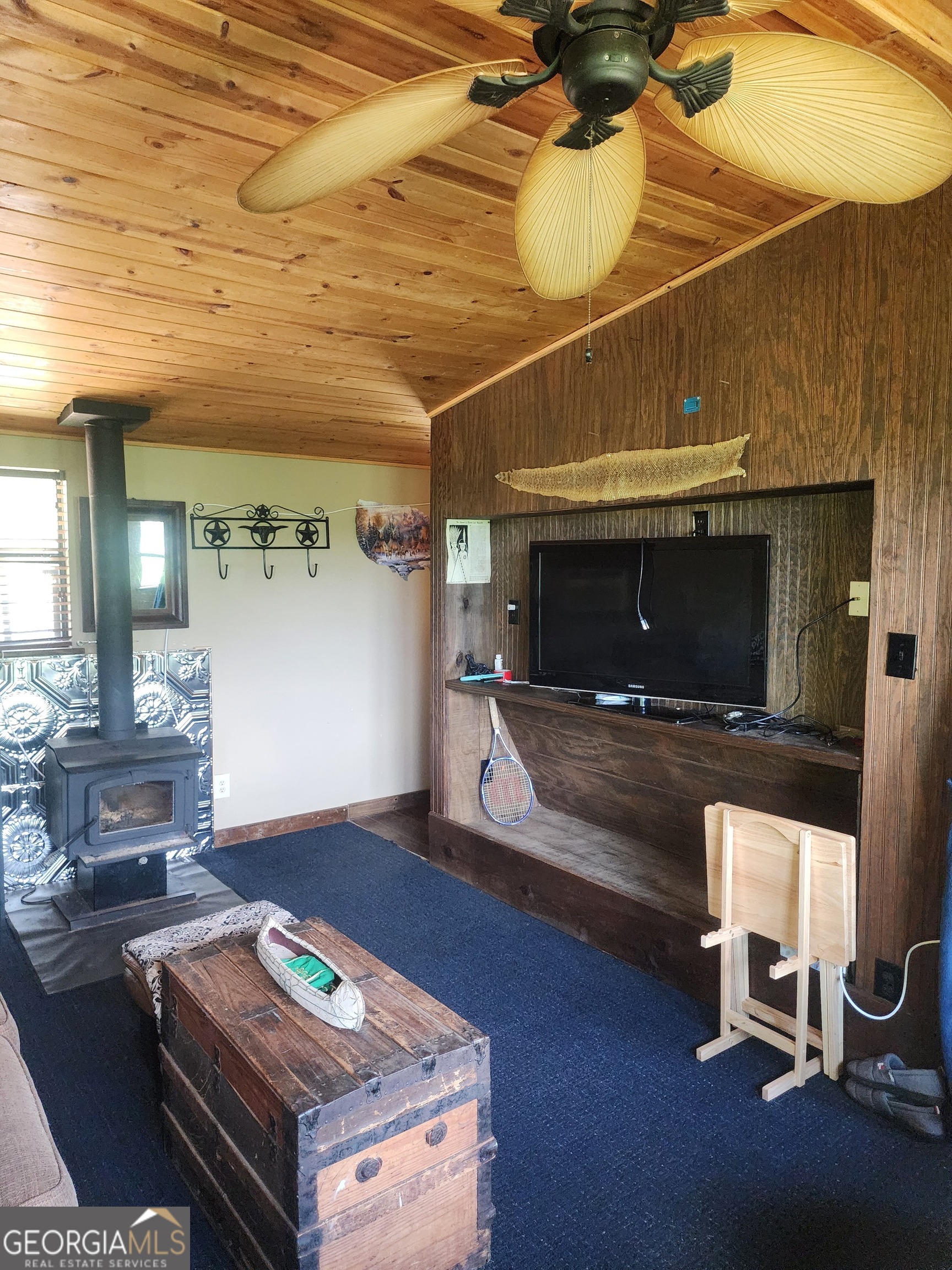 568 Yonah Lake Road Toccoa, GA 30577 - Photo 13 of 21 a living room with furniture and a fireplace