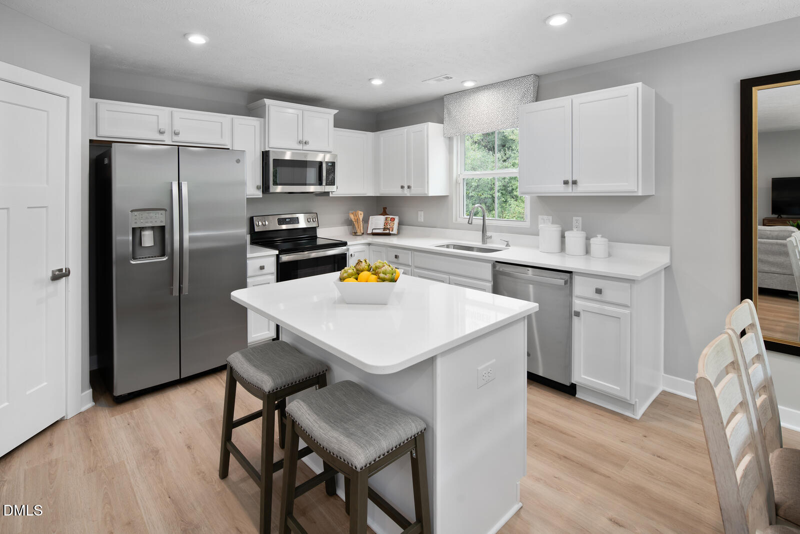 125 Springwood Lane Franklinton, NC 27525 - Photo 5 of 26 a kitchen with stainless steel appliances a sink a stove a refrigerator cabinets and wooden floor