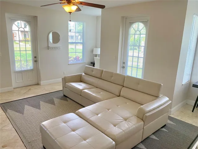 a living room with furniture and a window