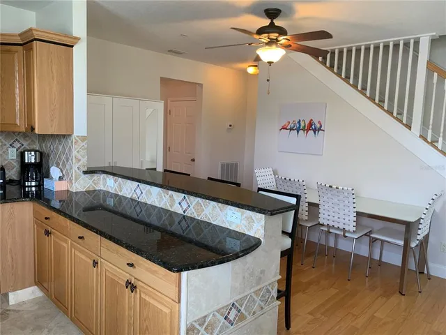 a kitchen with a cabinets a sink and appliances