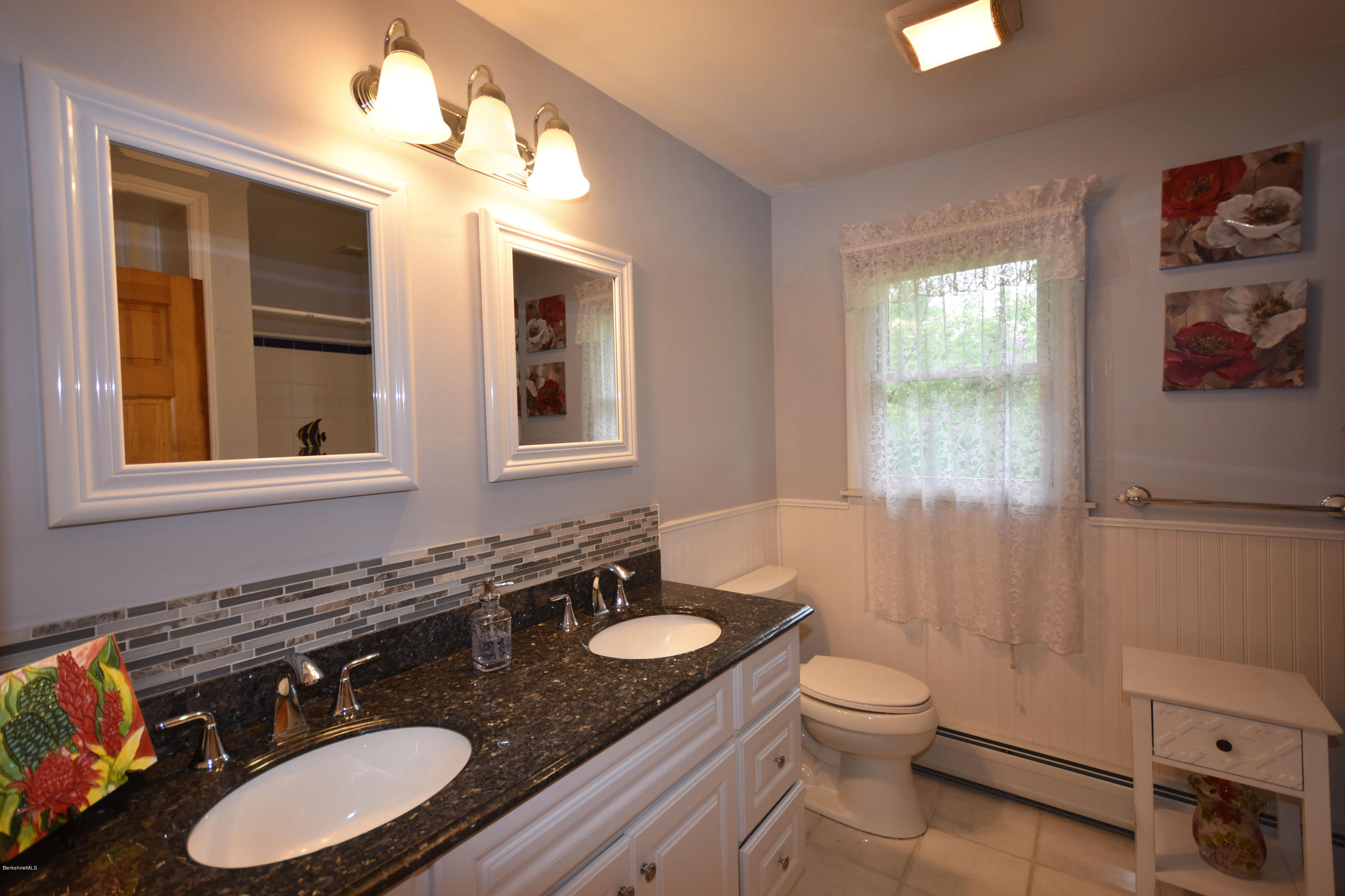 489 South Washington State Road Washington, MA 01223 - Photo 28 of 49 a bathroom with a granite countertop sink toilet a mirror and shower