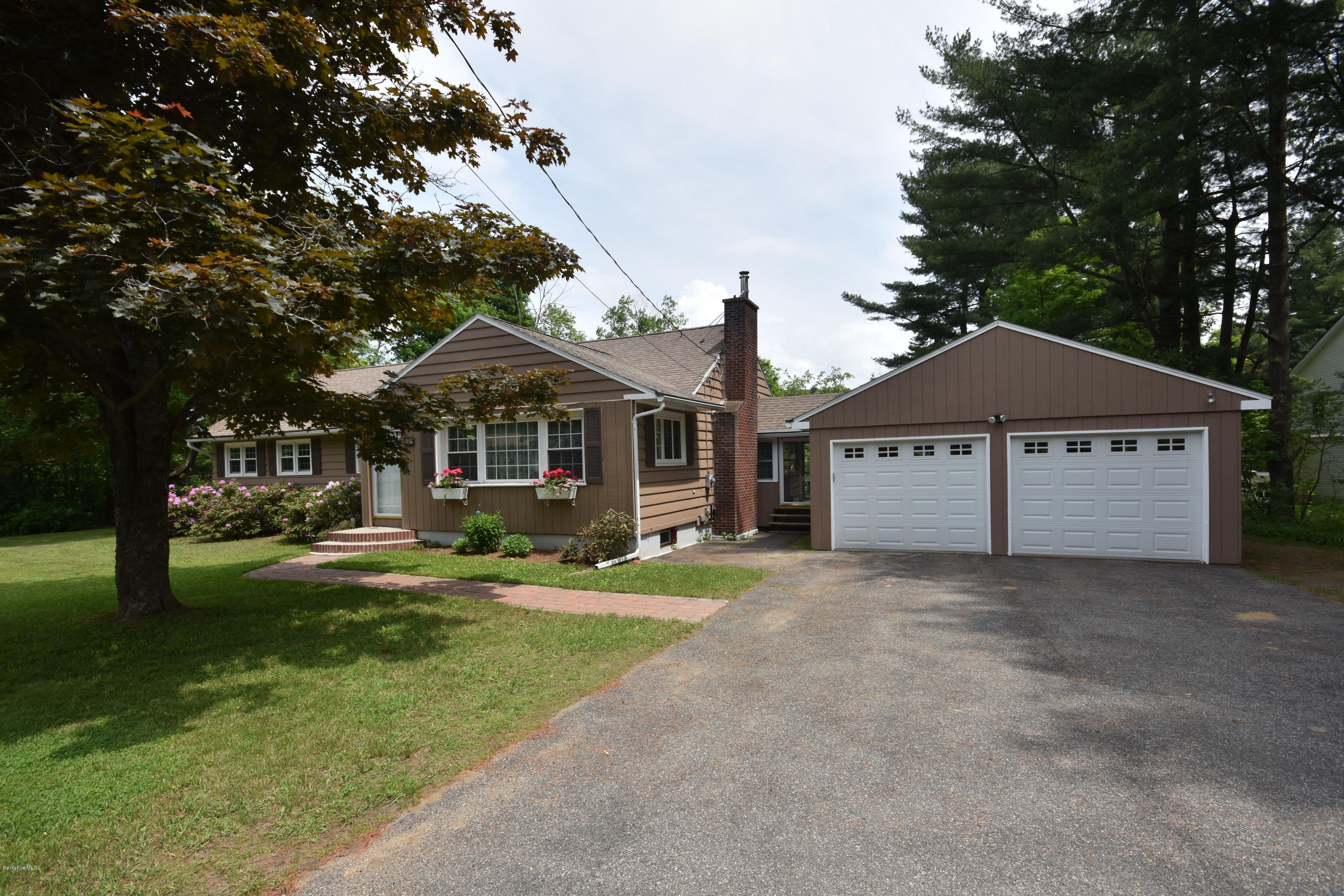 489 South Washington State Road Washington, MA 01223 - Photo 6 of 49 a front view of a house with a yard and garage