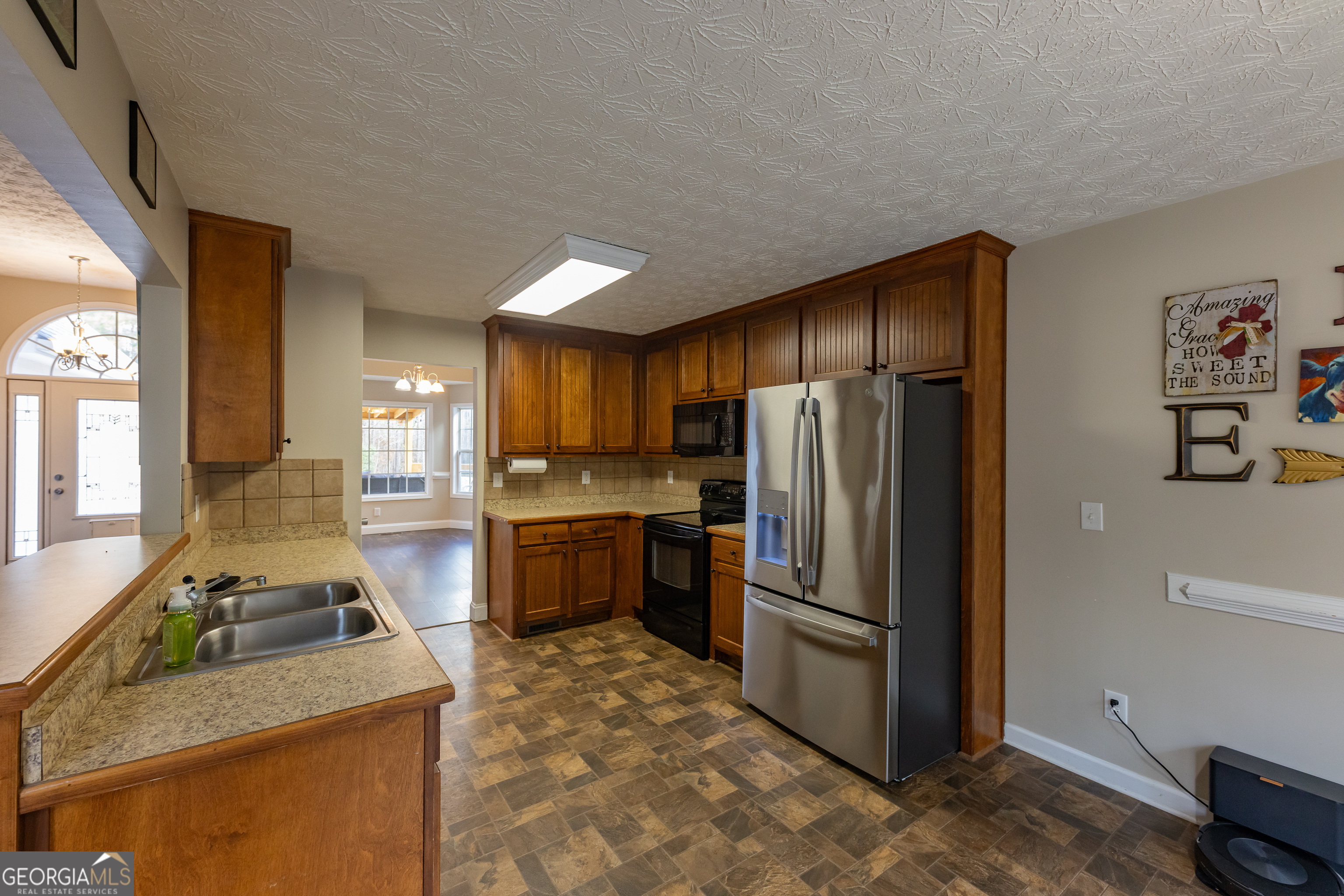 123 Rabbit Run Drive Meansville, GA 30256 - Photo 12 of 101 a kitchen with a refrigerator sink and stove