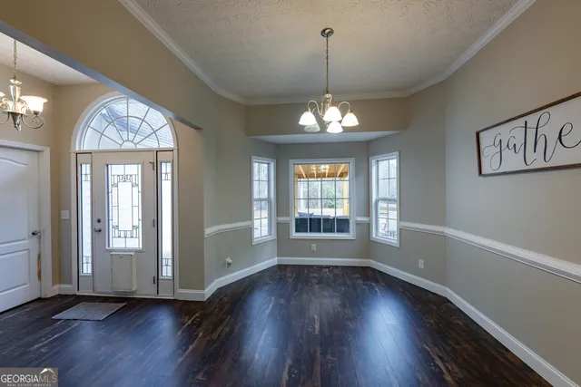 a bedroom with a bed and a potted plant