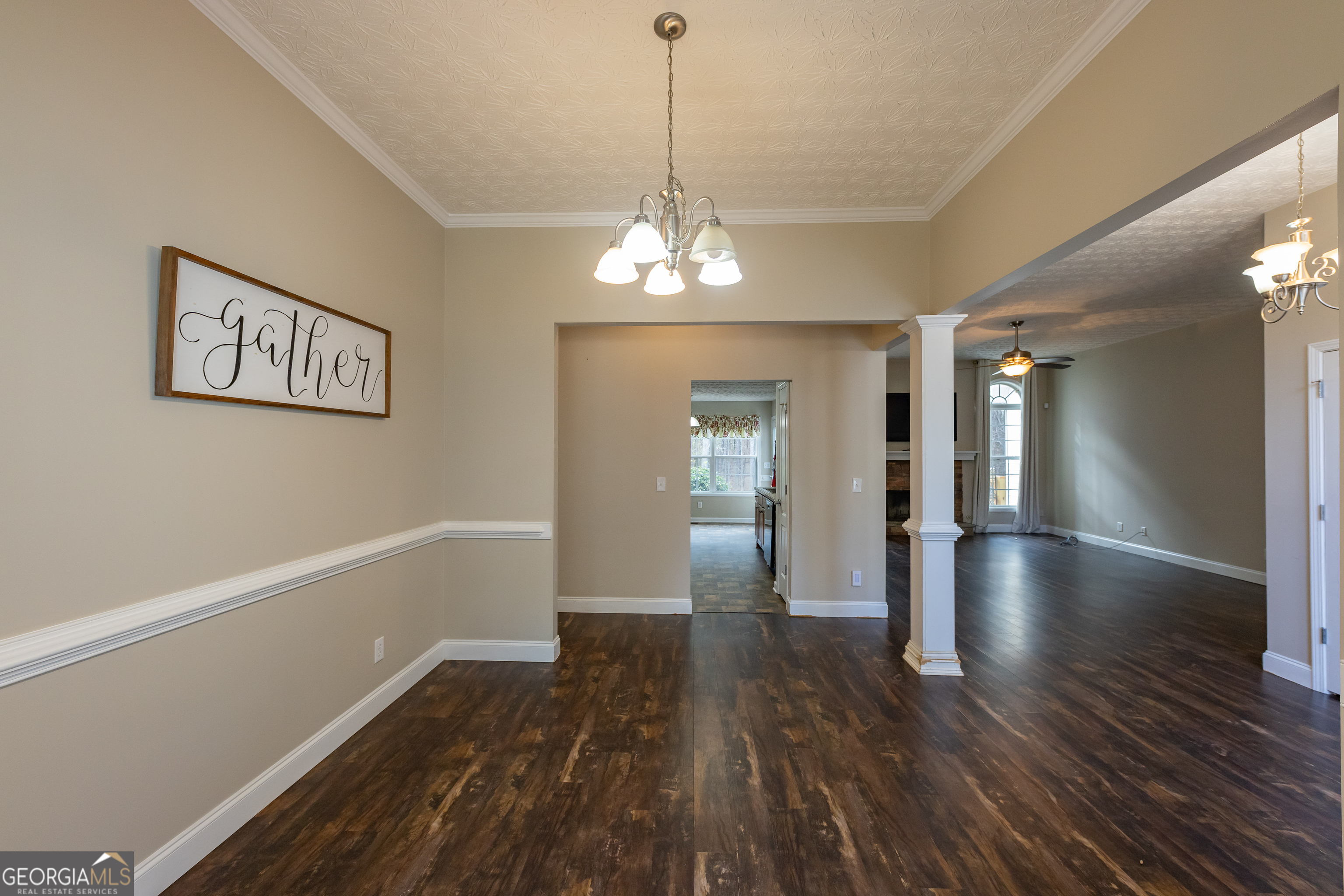 123 Rabbit Run Drive Meansville, GA 30256 - Photo 15 of 101 a view of a room with wooden floor and chandelier