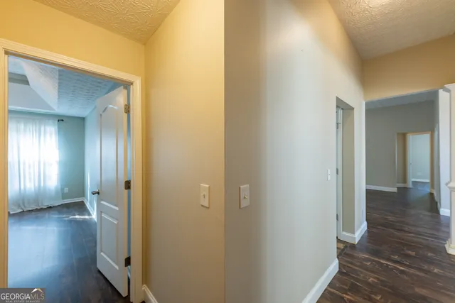 a bed room with a bed and a potted plant