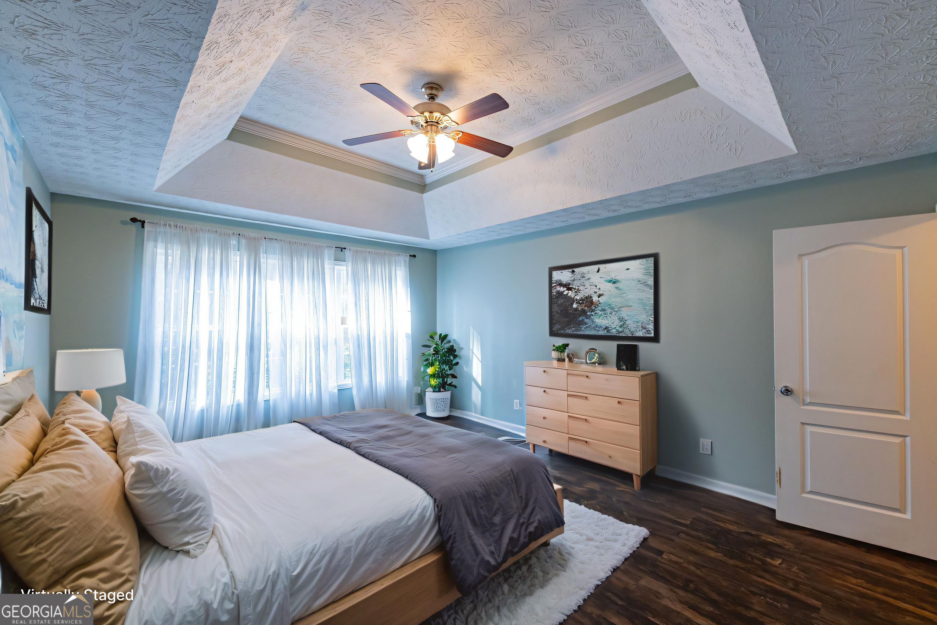 123 Rabbit Run Drive Meansville, GA 30256 - Photo 19 of 101 a bedroom with a bed and a chandelier