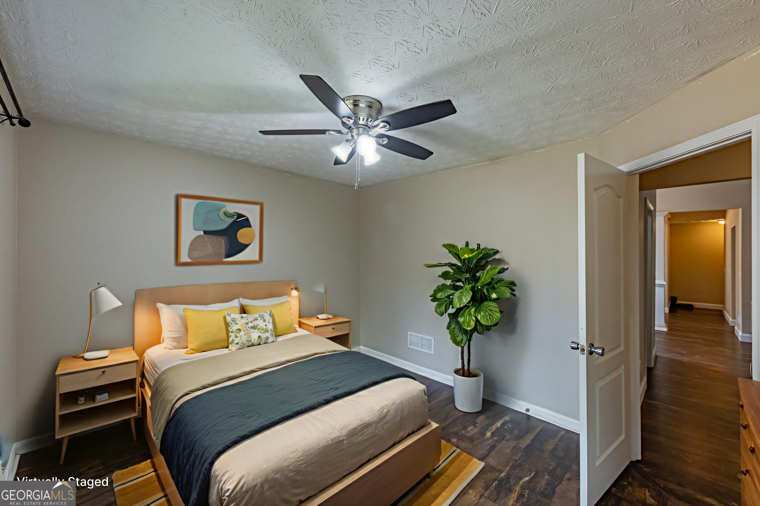 123 Rabbit Run Drive Meansville, GA 30256 - Photo 26 of 101 a bedroom with a bed and a potted plant