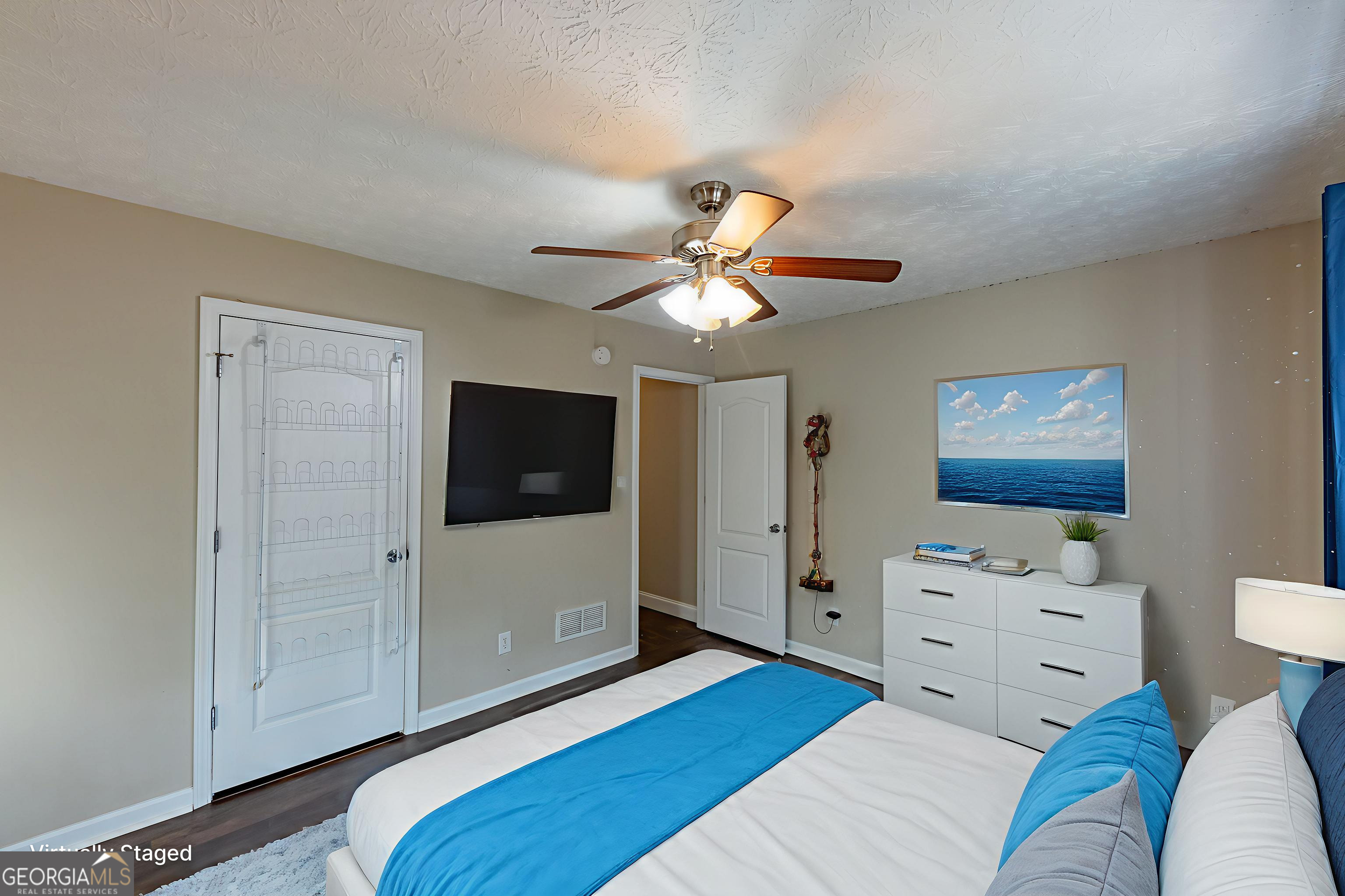 123 Rabbit Run Drive Meansville, GA 30256 - Photo 29 of 101 a bedroom with a bed and a flat screen tv