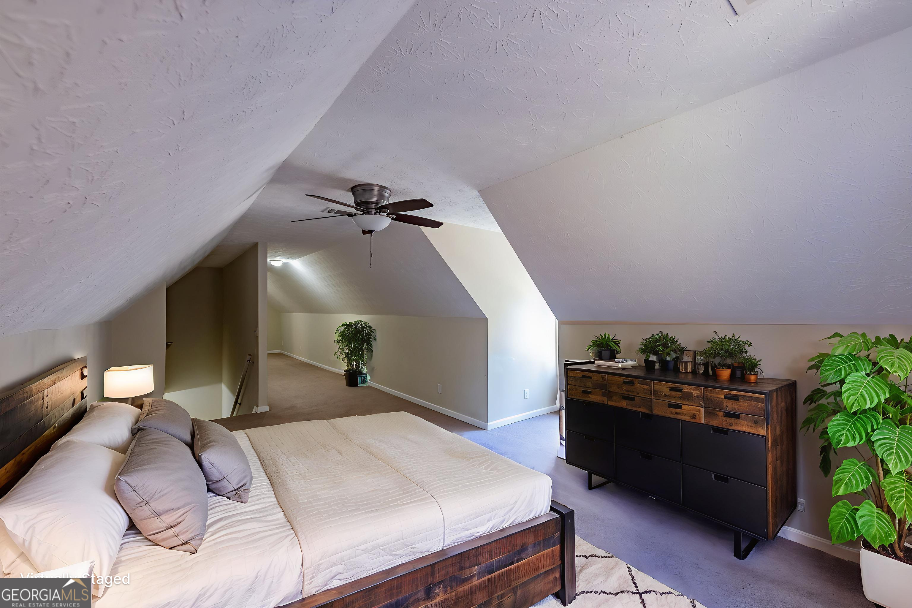 123 Rabbit Run Drive Meansville, GA 30256 - Photo 32 of 101 a bed room with a bed and a potted plant