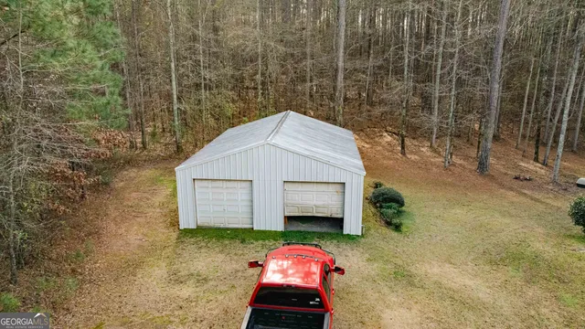 an aerial view of residential houses with outdoor and green space