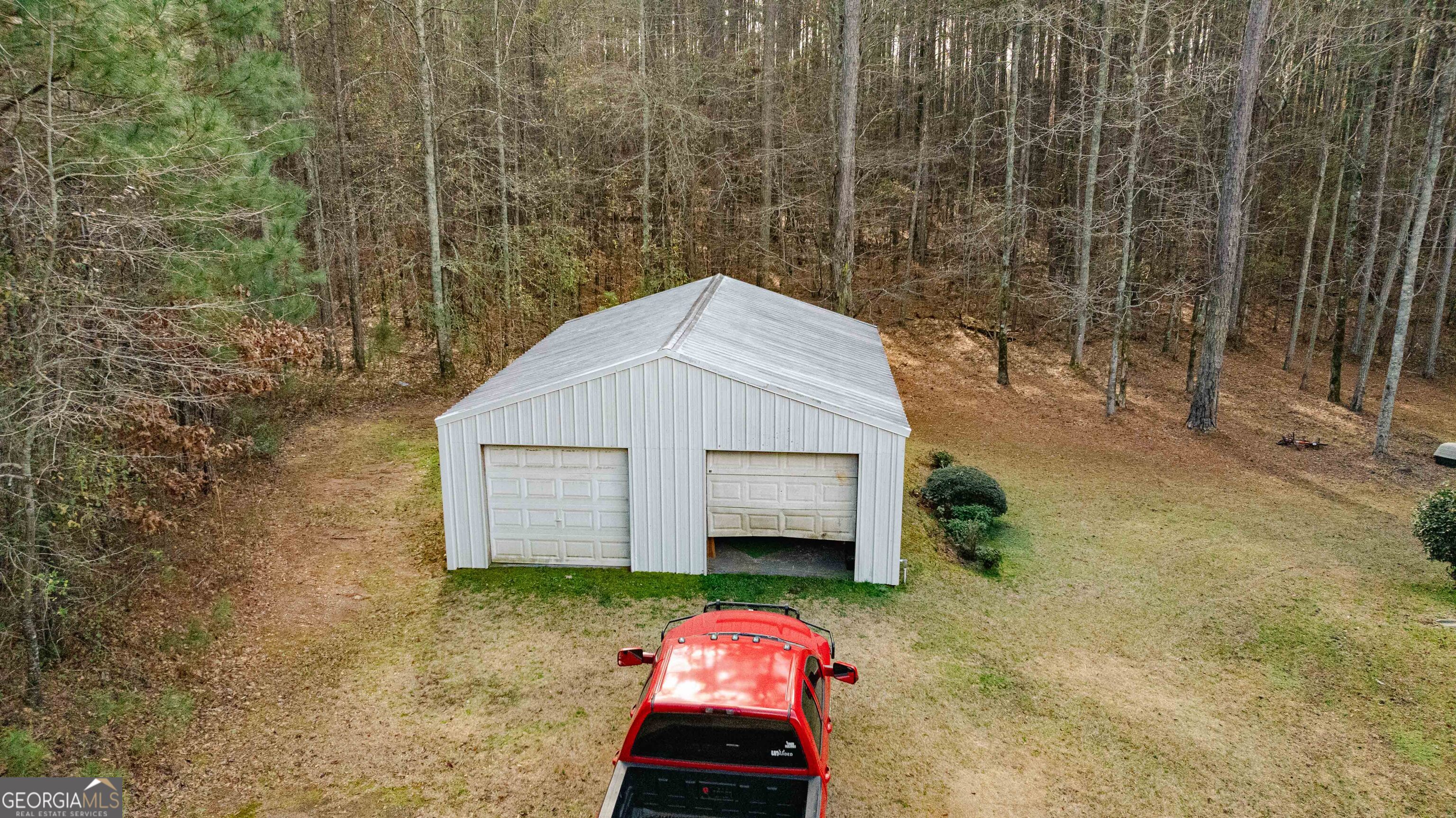 123 Rabbit Run Drive Meansville, GA 30256 - Photo 47 of 101 a front view of a house with a yard