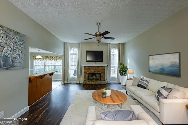 wooden floor in an empty room with a fireplace