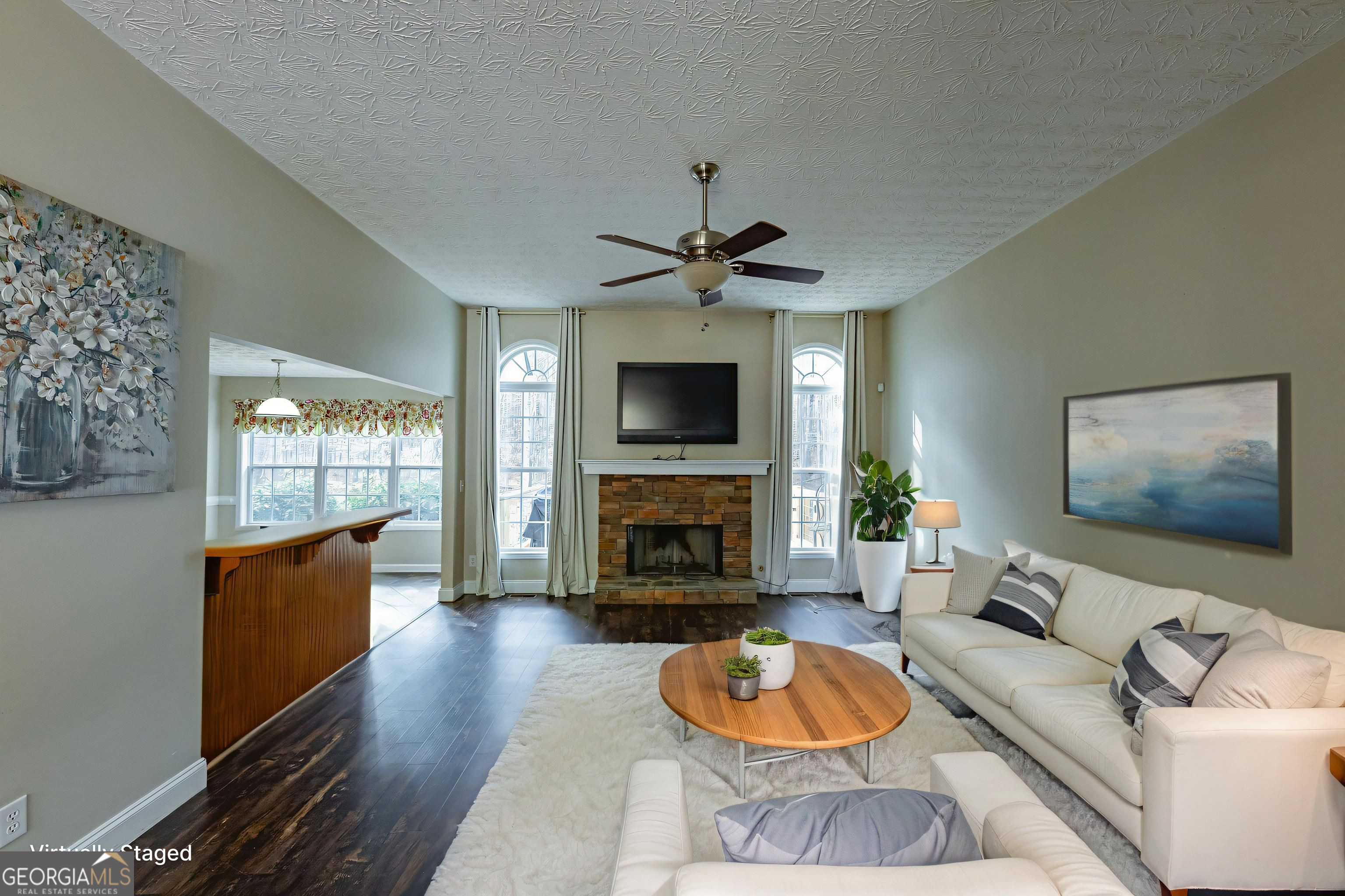 123 Rabbit Run Drive Meansville, GA 30256 - Photo 5 of 101 a living room with furniture a fireplace and a flat screen tv