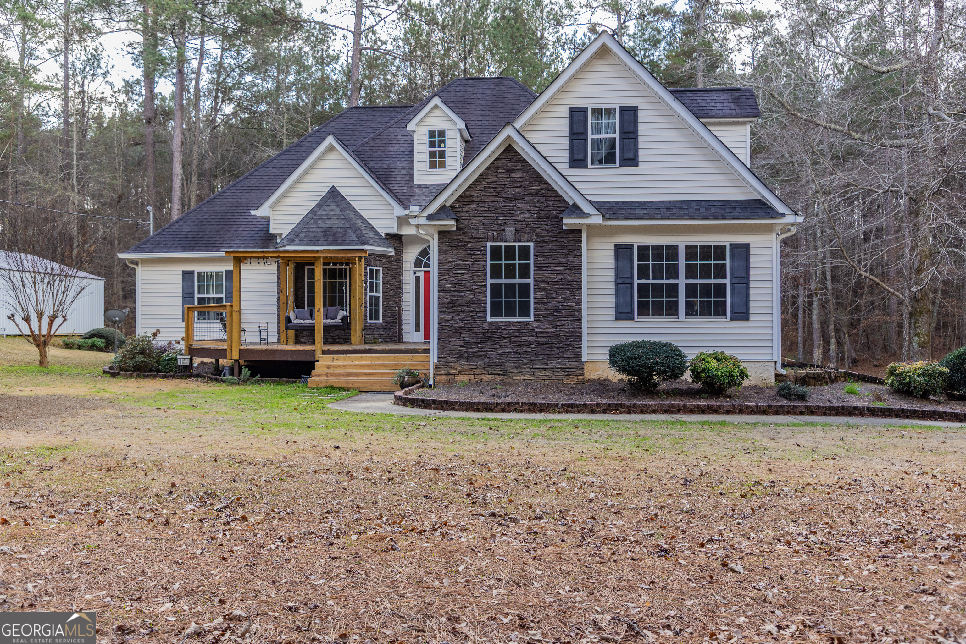 123 Rabbit Run Drive Meansville, GA 30256 - Photo 52 of 101 a front view of a house with a yard