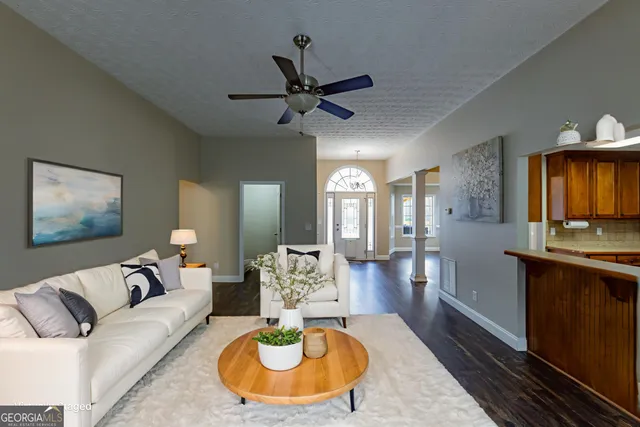 a view of a dining room with furniture window and wooden floor