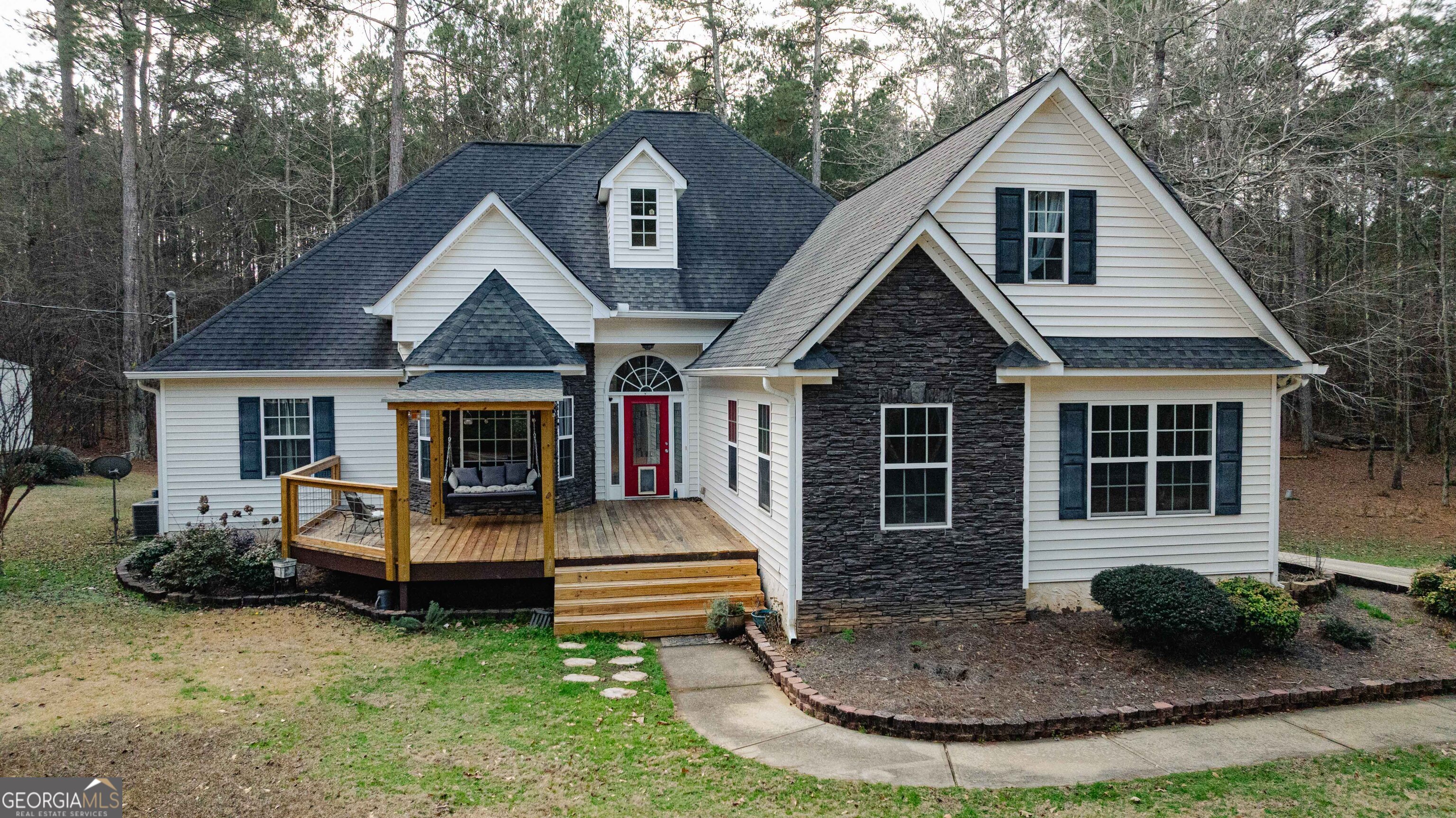 123 Rabbit Run Drive Meansville, GA 30256 - Photo 81 of 101 a front view of a house with garden