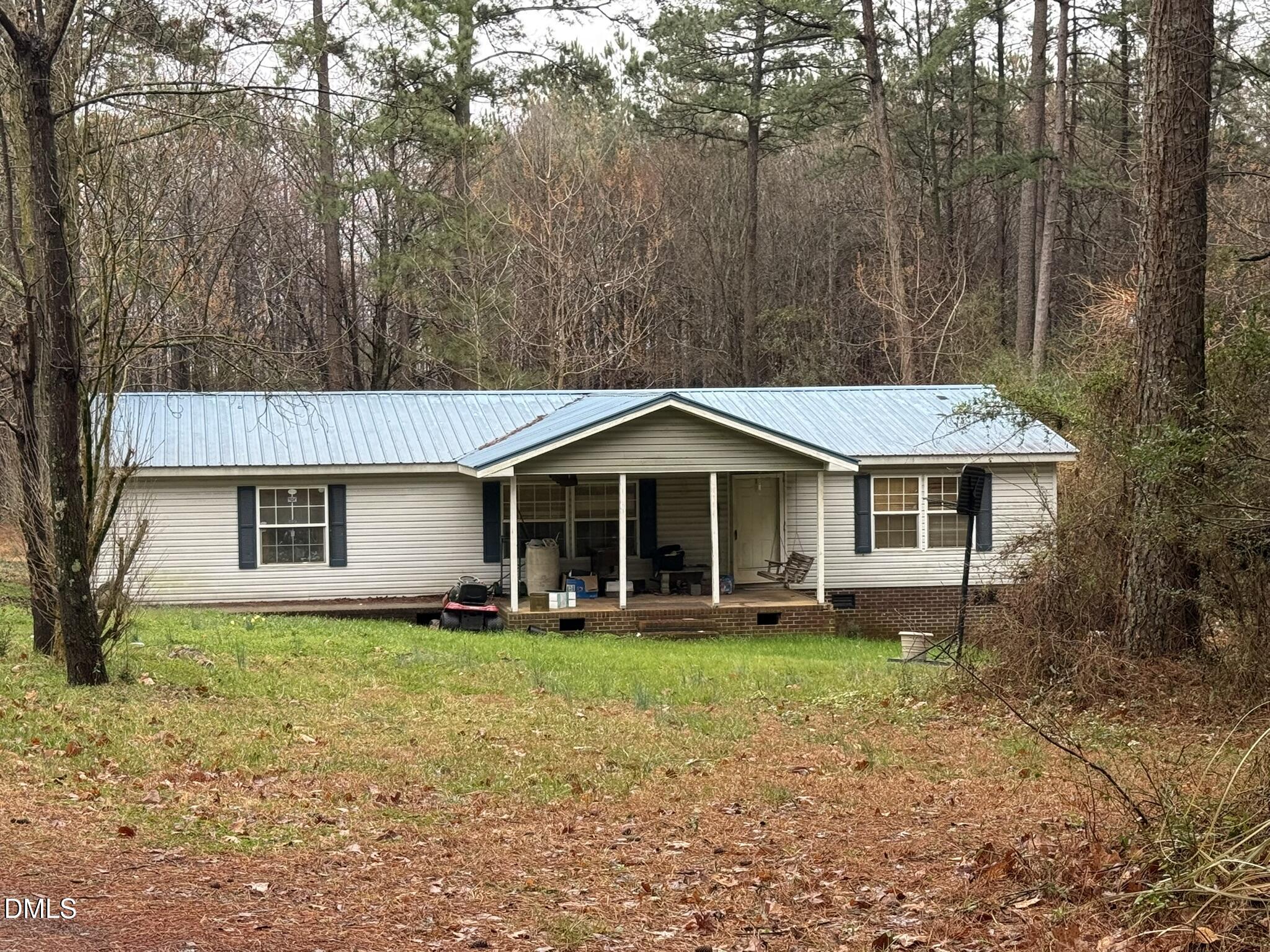 4749 Buckhorn Road Sanford, NC 27330 - Photo 18 of 18 a front view of a house with garden