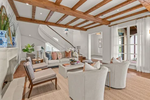 a dining room with furniture and wooden floor