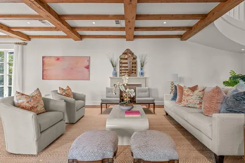 a living room with furniture and a rug