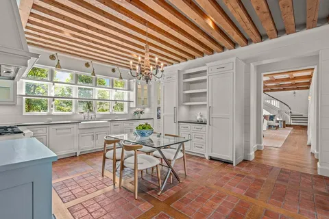 a open kitchen with a table and chairs in it