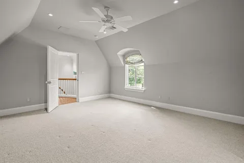 an empty room with a empty space and windows