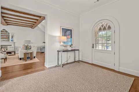 a view of a livingroom with furniture and hardwood floor