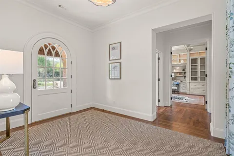 an empty room with windows and closet