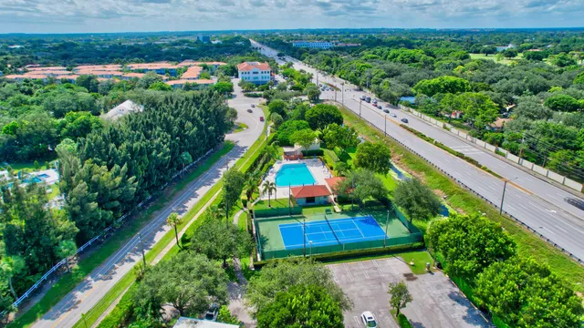a view of a park with swings and slides