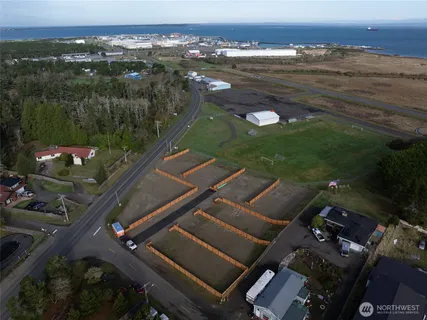 an aerial view of residential houses with outdoor space