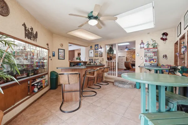 a kitchen with stainless steel appliances granite countertop a sink a stove cabinets and a refrigerator