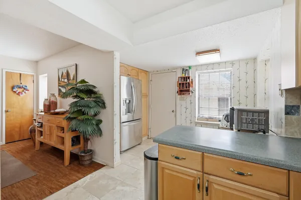 a living room with furniture ceiling fan and a rug