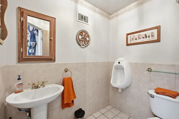 a kitchen with granite countertop a sink stove and cabinets